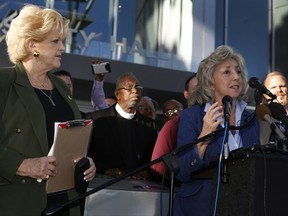 Las Vegas Mayor Carolyn Goodman, left, listens to Congresswoman Dina Titus, D-Nev., during a prayer vigil in honor of those affected by the shooting on the Las Vegas Strip, in front of Las Vegas City Hall in Las Vegas, Monday, Oct. 2, 2017. The vigil was held in honor of the over 50 people killed and hundreds injured in a mass shooting at an outdoor music concert late Sunday. (Steve Marcus/Las Vegas Sun via AP)