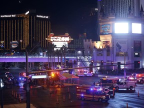 Las Vegas Metro Police and medical workers block off an intersection after a mass shooting at a music festival on the Las Vegas Strip on Sunday, Oct. 1, 2017.