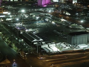 A night time view of the scene of a mass shooting, bottom right, on the Las Vegas Strip, Monday, Oct. 2, 2017, in Las Vegas. (AP Photo/Marcio Jose Sanchez)