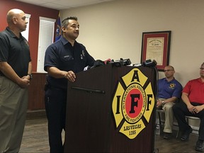FILE - In this Tuesday, Oct. 3, 2017, file photo, Jesse Gomez of the Clark County Fire Department describes his off-duty experience as a concertgoer at the country music festival that was attacked by a gunman on Sunday night, killing scores of people on in Las Vegas, Nev. The Sunday night crowd of about 20,000 country music fans happened to include many off-duty police and firefighters, who sprang into the role of first responders when tragedy struck and played an important role in saving lives. (AP Photo/Anita Snow, File)