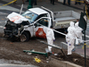 Investigators inspect a truck used in a terrorist attack in New York on Oct. 31, 2017.