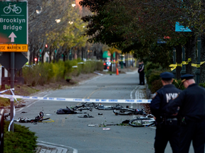 Bicycles and debris lie on a bike path after a motorist drove onto the path in a terrorist attack near the World Trade Center memorial, striking and killing several people Tuesday, Oct. 31, 2017, in New York.