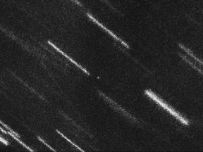 This image released by the European Southern Observatory on Aug. 10, 2017 shows near Earth asteroid 2012 TC4, the dot at centre