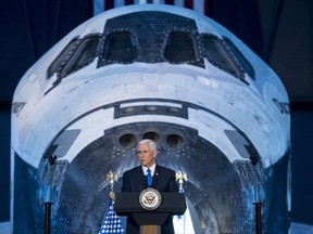 Vice President Mike Pence delivers opening remarks during the National Space Council's first meeting, Thursday, Oct. 5, 2017 at the Smithsonian National Air and Space Museum's Steven F. Udvar-Hazy Center in Chantilly, Va. The National Space Council, chaired by Pence,  heard testimony from representatives from civil space, commercial space, and national security space industry representatives. (Joel Kowsky/NASA via AP)