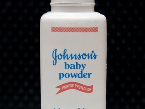 FILE - In this April 15, 2011, file photo, a bottle of Johnson's baby powder is displayed in San Francisco. A judge on Friday, Oct. 20, 2017 tossed out a $417 million jury award to a woman who claimed she developed ovarian cancer by using Johnson & Johnson talc-based baby powder for feminine hygiene. Los Angeles County Superior Court Judge Maren Nelson granted the company's request for a new trial, saying there were errors and jury misconduct in the previous trial that ended with the award two months ago. (AP Photo/Jeff Chiu, File)