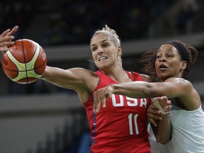 FILE - In this Thursday, Aug. 18, 2016 file photo, United States' Elena Delle Donne (11) and France's Marielle Amant, right, reach out for the ball during a women's semifinal round basketball game at the 2016 Summer Olympics in Rio de Janeiro, Brazil. Elena Delle Donne has always tried to give back and help others over the course of her life. So it's no surprise that her wedding to Amanda Clifton on Nov. 3 will have a major charitable component to it. From the floral arrangements that will be donated to nearby senior centers and women's shelters to the wedding registry that will benefit Delle Donne's foundation, the pair will be helping others. Delle Donne's foundation supports the Special Olympics and victims of Lyme disease. (AP Photo/Eric Gay, File)