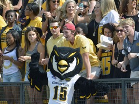 FILE - In this Sept. 12, 2015, file photo, Kennesaw States' mascot, the owl, cheers along with the crowd during their an NCAA college football game against Edward Waters, in Kennesaw, Ga. A Georgia lawmaker says Scrappy the Owl, the mascot at the university where five cheerleaders have been kneeling during the national anthem, had no business leading students in a march through campus to support the cheerleaders. The five Kennesaw State University cheerleaders vow to kneel in the stadium tunnel when the anthem is played at Saturday's homecoming football game. They were moved off-field after an earlier protest.(AP Photo/Lisa Marie Pane, File)