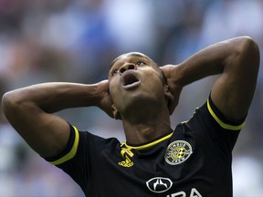 FILE - In this Sept. 16, 2017, file photo, Columbus Crew's Ola Kamara reacts after missing a scoring chance during the first half of an MLS soccer game against the Vancouver Whitecaps in Vancouver, British Columbia.  The owner of the Crew SC says the team will move to Austin, Texas, unless a new stadium is built in Columbus. Precourt Sports Ventures, owner of the Major League Soccer club since 2013, said it "is exploring strategic options to ensure the long-term viability of the club." (Darryl Dyck/The Canadian Press via AP, File)