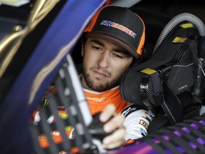 FILE - In this Aug. 5, 2017, file photo, Chase Elliott prepares his car for a practice for the NASCAR Cup Series auto race in Watkins Glen, N.Y. Elliott was fastest of the playoff contenders on Saturday, Oct. 28, 2017,  in the final practice before Sunday's race at Martinsville Speedway.  (AP Photo/Matt Slocum, File)