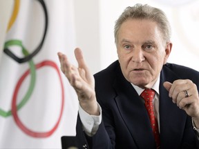 FILE - This is a June 3 , 2013, file photo showing Denis Oswald speaking during a press conference in Lausanne, Switzerland. Oswald, leader of an IOC delegation in charge of reviewing 28 cases involving athletes at Sochi, wrote to the head of the IOC Athletes Commission this week to update the timeline of cases stemming from a report detailing a Russian doping scheme at the 2014 Olympics and beforehand.  Investigators expect to have "a number" of doping cases involving Russians at the Sochi Olympics resolved by the end of November, but they have no plans to dictate the eligibility of these athletes for next year's Winter Games in Pyeongchang. (Laurent Gillieron/Keystone via AP, File)