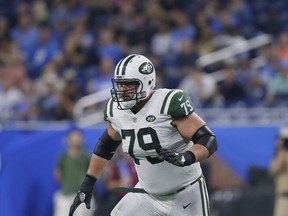 FILE - In this Saturday, Aug. 19, 2017 file photo, New York Jets tackle Brent Qvale (79) during the second half of an NFL preseason football game against the Detroit Lions in Detroit. Brent Qvale has dealt with it all his life, people looking at his last name and freezing before absolutely butchering it.  It's those first two letters, the Q and the V that have turned his family's name into an absolute tongue twister for some. (AP Photo/Duane Burleson, File)
