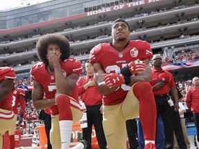 FILE - In this Oct. 2, 2016 file photo, San Francisco quarterback Colin Kaepernick, left, and safety Eric Reid kneel during the national anthem before an NFL football game against the Dallas Cowboys in Santa Clara, Calif.  The 49ers won't be forcing their players to stand during the national anthem, safety Eric Reid said Wednesday, Oct. 11, 2017. Reid, the first player to join Colin Kaepernick in protest last season, said he had a conversation recently with 49(AP Photo/Marcio Jose Sanchez, File)