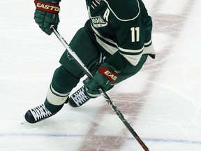 FILE - In this March 22, 2016, file photo, Minnesota Wild's Zach Parise skates against the Los Angeles Kings in the first period of an NHL hockey game in St. Paul, Minn.  Parise will miss at least two more months, after undergoing surgery on his lower back, the Wild announced Tuesday, Oct. 24, 2017.  (AP Photo/Jim Mone, File)