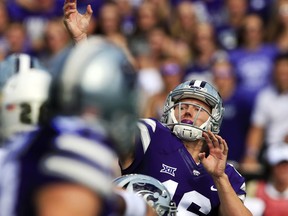 FILE - In this Saturday, Sept. 30, 2017, file photo, Kansas State quarterback Jesse Ertz passes down field during the first half of an NCAA college football game against Baylor in Manhattan, Kan. Five times. That's how many times Kansas State threw the ball in the second half against Baylor. Part of it was due to the score, but part of it was also due to ongoing trouble in the Wildcats passing game. (AP Photo/Orlin Wagner, File)