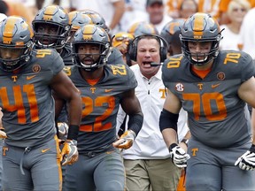 FILE - In this Saturday, Sept. 30, 2017, file photo, Tennessee head coach Butch Jones yells to his players during the first half of a 41-0 loss to Georgia in an NCAA college football game in Knoxville, Tenn. Tennessee is using its off week to try regrouping following a dispiriting three-week stretch that included its worst home defeat since 1905 and put the heat squarely on embattled coach Jones. (AP Photo/Wade Payne, File)