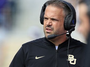 FILE - In this Sept. 30, 2017, file photo, Baylor head coach Matt Rhule watches from the sideline during the first half of an NCAA college football game against Kansas State, in Manhattan, Kan. Rhule wants all those people texting, telling him to hang in there and asking if he's OK, to know that he's doing great. No, he doesn't like that the Bears are still winless. But while having all those young players on the field is hard, that is an  exhilarating part in building a foundation for the future. (AP Photo/Orlin Wagner, File)