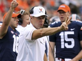 FILE - In this Sept. 3, 2016, file photo, Virginia head coach Bronco Mendenhall calls for a two-point conversion during the second half of an NCAA football game against Richmond in Charlottesville, Va. With a 3-1 record and coming off a bye week, Virginia turns its attention to recent nemesis Duke. (AP Photo/Andrew Shurtleff, File)