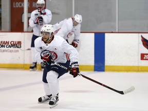 FILE - In this Sept. 15, 2017, file photo, Washington Capitals' Nathan Walker practices in Arlington, Va. Walker is set to become the first Australian player to dress in an NHL game when he makes his debut Saturday night, Oct. 7, 2017, against the Montreal Canadiens. (AP Photo/Alex Brandon, File)