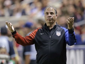 FILE - In this June 3, 2017, file photo, U.S. coach Bruce Arena reacts on the sideline during the second half of the team's international friendly soccer match against Venezuela, in Sandy, Utah. Arena has resigned in the wake of the teams U.S. national team's crash out of contention for the 2018 World Cup. "We didn't get the job done, and I accept responsibility," Arena said in a statement on Friday, Oct. 13, 2017. (AP Photo/Rick Bowmer)