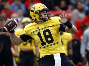 FILE - In this Saturday, Oct. 28, 2017, file photo, Maryland quarterback Max Bortenschlager throws to a receiver in the first half of an NCAA college football game against Indiana in College Park, Md. The former third-string, a pocket passer in a read-option offense, has kept alive Maryland's bid to become bowl eligible. (AP Photo/Patrick Semansky, File)
