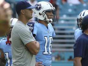 FILE - In this Oct. 8, 2017, file photo, Tennessee Titans quarterback Marcus Mariota (8) watches the warms up with quarterback Matt Cassel (16) before an NFL football game against the Miami Dolphins, in Miami Gardens, Fla. The Titans hit the field for an extra workout late Wednesday afternoon, Oct. 11, 2017,  with all eyes watching Marcus Mariota to see if at least one starting quarterback will be available Monday night against the Colts. (AP Photo/Joel Auerbach, File)