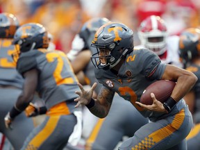 FILE - In this Sept. 30, 2017, file photo, Tennessee quarterback Jarrett Guarantano (2) runs in the second half of an NCAA college football game against Georgia, in Knoxville, Tenn. Tennessee is making a quarterback switch with Jarrett Guarantano taking over for Quinten Dormady as the Volunteers seek to bounce back from their first shutout loss since 1994. Vols coach Butch Jones said Wednesday, Oct. 11, 2017,  that Guarantano would get the starting nod Saturday when Tennessee (3-2, 0-2 SEC) hosts South Carolina (4-2, 2-2). (AP Photo/Wade Payne, File)