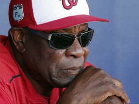 FILE - In this March 11, 2017, file photo, Washington Nationals manager Dusty Baker talks to reporters in the dugout before playing New York Mets in a spring training baseball game in Port St. Lucie, Fla. The Nationals announced Friday, Oct. 20, 2017, that Baker won't be back next season. Baker led the Nationals to the NL East title in each of his two years with the club. But Washington lost its NL Division Series both times. (AP Photo/John Bazemore, File)