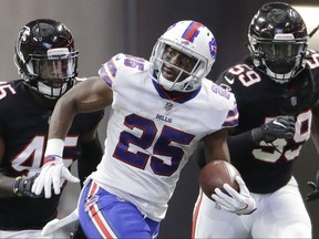FILE - In this Oct. 1, 2017, file photo, Buffalo Bills running back LeSean McCoy (25) runs past Atlanta Falcons' De'Vondre Campbell (59) and Deion Jones (45) during the second half of an NFL football game, in Atlanta. The Bills play against the Buccaneers in Buffalo on Sunday. (AP Photo/David Goldman, File)