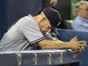 FILE - In this Aug. 8, 2017, file photo, New York Yankees manager Joe Girardi reacts during the sixth inning of their baseball game against the Toronto Blue Jays, in Toronto. The New York Yankees announced Thursday, Oct. 26, 2017, that Girardi will not return to the team in the 2018 season. The announcement was made by Yankees Senior Vice President and General Manager Brian Cashman. (Fred Thornhill/The Canadian Press via AP)