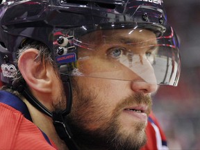 FILE - In this March 14, 2017, file photo, Washington Capitals left wing Alex Ovechkin (8), of Russia, looks on from the bench during the first period of an NHL hockey game against the Minnesota Wild in Washington. Ovechkin is the NHL's best goal-scorer of this generation, but at age 32 what's a realistic expectation? The Capitals still think he can score 50, or at least more than his 33 last year (AP Photo/Nick Wass, File)