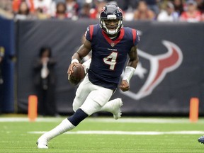 FILE - In this Sunday, Oct. 1, 2017, file photo, Houston Texans quarterback Deshaun Watson (4) runs against the Tennessee Titans during the second half of an NFL football game in Houston. Watson is doing things that no rookie quarterback has done in the NFL since the likes of Fran Tarkenton in the 1960s. Most everyone is wowed by what he is doing for the Texans. Everyone, that is, except Watson himself.  (AP Photo/George Bridges, File)