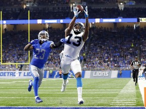 FILE - In this Oct. 8, 2017, file photo, Carolina Panthers wide receiver Kelvin Benjamin (13) makes a touchdown catch as Detroit Lions cornerback Darius Slay (23) defends during an NFL football game in Detroit. The Buffalo Bills have upgraded their patchwork group of receivers by agreeing to acquire Benjamin in a trade with the Panthers. Carolina acquired Buffalo's third- and seventh-round picks in next year's draft in making the deal reached just before the NFL's trade deadline on Tuesday, Oct. 31, 2017.  (AP Photo/Paul Sancya, File)