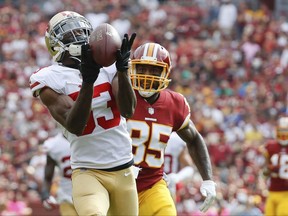 FILE - In this Oct. 15, 2017, file photo, San Francisco 49ers cornerback Rashard Robinson (33) intercepts a pass intended for Washington Redskins tight end Vernon Davis (85) during the first half of an NFL football game in Landover, Md.  The New York Jets have acquired cornerback Rashard Robinson from the San Francisco 49ers for a pick in next year's draft.  A person with direct knowledge of the deal tells The Associated Press that New York traded a fifth-rounder to San Francisco on Tuesday, Oct. 31, 2017. (AP Photo/Alex Brandon, File)
