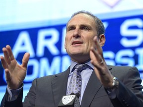 FILE - In this July 26, 2017, file photo, Pac-12 Commissioner Larry Scott speaks at Pac-12 NCAA college football Media Day in the Hollywood section of Los Angeles. Scott met with women's basketball coaches Wednesday, Oct. 11, 2017, and reminded them about his tough stance on integrity given the scandal surrounding the men's game. (AP Photo/Mark J. Terrill, File)