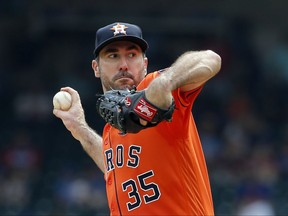 FILE - In this Sept. 27, 2017, file photo, Houston Astros starting pitcher Justin Verlander winds up to throw to the Texas Rangers during a baseball game in Arlington, Texas. The Astros will start Verlander in Game 1 of the AL Division Series against Chris Sale and the Boston Red Sox on Thursday, Oct 5. Manager A.J. Hinch announced the decision Tuesday, adding that left-hander Dallas Keuchel, who won the AL Cy Young Award in 2015, will start Game 2 on Friday against Drew Pomeranz. (AP Photo/Tony Gutierrez, File)