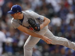 FILE - In this Oct. 1, 2017, file photo, Los Angeles Dodgers starting pitcher Brandon McCarthy (38) in the sixth inning of a baseball game Sunday,, in Denver. Shortstop Corey Seager and right-hander Brandon McCarthy were added to the active roster for the World Series by the Los Angeles Dodgers, who dropped outfielder Curtis Granderson and backup catcher Kyle Farmer. (AP Photo/David Zalubowski, File)