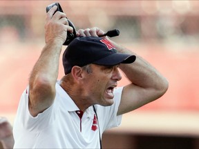 FILE - In this Sept. 23, 2017, file photo, Nebraska head coach Mike Riley yells instructions during the second half of an NCAA college football game against Rutgers in Lincoln, Neb. The Ohio State-Nebraska game matches two of the five programs with the most major-college football wins in history. (AP Photo/Nati Harnik, File)
