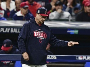 In this Wednesday, Oct. 11, 2017 photo, Cleveland Indians manager Terry Francona signals the bullpen as he comes out of the dugout to pull Cleveland Indians starting pitcher Corey Kluber during the fourth inning of Game 5 of baseball's American League Division Series against the New York Yankees in Cleveland. (AP Photo/David Dermer)