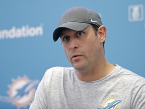 FILE - In this Oct. 9, 2017, file photo, Miami Dolphins head coach Adam Gase talks to reporters during a news conference, in Davie, Fla. The Dolphins rank last in the NFL in half a dozen major offensive categories and have been outgained by 363 yards this season, yet because they keep winning close games, only three teams in the AFC have a better record. The Dolphins take on the New York Jets on Sunday.  (AP Photo/Alan Diaz)