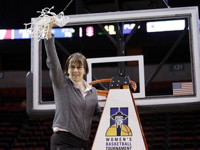 FILE - In this March 5, 2017, file photo, Stanford head coach Tara VanDerveer waves the net after finishing cutting it down after her team beat Oregon State in the Pac-12 Conference championship NCAA college basketball game in Seattle. VanDerveer has signed a three-year contract extension that takes the Hall of Fame Stanford coach through the 2019-20 season. She discussed her deal during Pac-12 media day, Wednesday, Oct. 11, 2017. VanDerveer is just the third Division I coach to reach 1,000 wins. (AP Photo/Elaine Thompson, File)