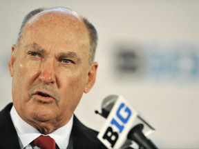 FILE - In this July 28, 2014, file photo, Big Ten Commissioner Jim Delany talks to the media during the Big Ten Football Media Day in Chicago.  The Big Ten will make its NCAA college basketball conference tournament debut at the Garden. The championship game, traditionally played on selection Sunday, will be played a week earlier on March 4. (AP Photo/Paul Beaty, File)