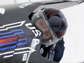 FILE - In this Dec. 13, 2014, file photo, United States' pilot Elana Meyers Taylor (front) and brakeman Cherrelle Garrett compete in a women's bobsled World Cup event in Lake Placid, N.Y. Meyers Taylor did not want it this way. She would have much preferred that the first official training run of the U.S. bobsled season would have gone to the person who traditionally was first down the ice for as long as anyone on the national team could remember. Steven Holcomb had that distinction for years. On Wednesday, Oct. 4, 2017, Meyers Taylor took the first run. (AP Photo/Mike Groll, File)