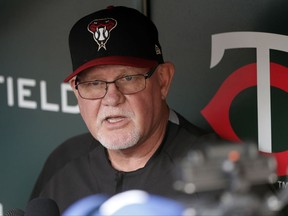 FILE - In this Friday, Aug. 18, 2017 file photo, former Minnesota Twins manager and present an Arizona Diamondbacks coach Ron Gardenhire visits with the media in the visitor's dugout prior to a baseball game between the two teams in Minneapolis. A person with knowledge of the discussions says the Detroit Tigers are in talks to hire Ron Gardenhire as manager. The person spoke on condition of anonymity Thursday, Oct. 19, 2017 because no announcement had been made.(AP Photo/Jim Mone, File)