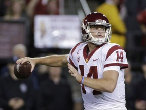 FILE - In this Friday, Sept. 29, 2017 file photo, Southern California quarterback Sam Darnold prepares to throw a pass during the first half of an NCAA college football game against Washington State in Pullman, Wash. After 13 consecutive victories, Sam Darnold had almost forgotten what it felt like to go back to work after a loss. Darnold is back in practice with a renewed vigor this week after his imperfect performance in the No. 14 Trojans' 30-27 loss at No. 11 Washington State last Friday, Sept. 29, 2017.(AP Photo/Young Kwak, File)