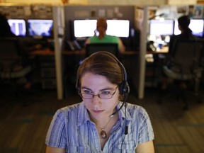 A hotline advocate takes a call from a potential victim of trafficking while working at the Human Trafficking Hotline call center, Tuesday, Sept. 26, 2017, in Washington. People in the anti-trafficking field say it performs well at two vital roles _ as a conduit for people to report suspected trafficking and as an immediate resource for trafficking victims in need of help. (AP Photo/Jacquelyn Martin)