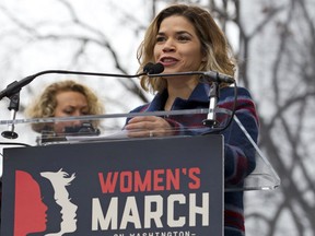 FILE - In this Saturday, Jan. 21, 2017, file photo, Actress America Ferrera speaks to the crowd during the women's march rally, in Washington. Ferrera, Roxane Gay and Jill Soloway are among those contributing essays to a book marking the one-year anniversary of January's Women's March. Dey Street, an imprint of William Morrow, told The Associated Press on Tuesday, Oct. 10, that "Together We Rise" will come out Jan. 16, 2018. (AP Photo/Jose Luis Magana, File)