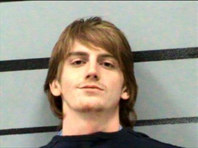 This Tuesday, Oct. 10, 2017 photo provided by the Lubbock County jail shows Hollis Daniels, who was charged with capital murder of a peace officer in the shooting of a campus officer at the school's police headquarters on Monday. Campus police took Daniels to the police station late Monday after finding evidence of drugs and drug paraphernalia in a room. (Lubbock County jail via AP)