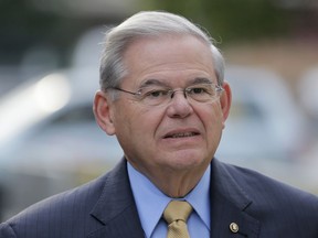 FILE - In this Sept. 6, 2017, file photo, Sen. Bob Menendez arrives to court for his federal corruption trial in Newark, N.J. When the government rests its bribery case against Menendez, the judge will make a crucial ruling on the New Jersey Democrat's motion to dismiss the charges. (AP Photo/Seth Wenig, File)