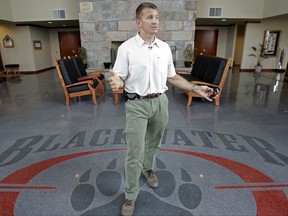 FILE - In a July, 21, 2008, file photo, founder and CEO of Blackwater Worldwide Erik Prince talks at Blackwater's offices in Moyock, N.C. Prince is considering a challenge to Republican Sen. John Barrasso, according to a person familiar with Prince's thinking. (AP Photo/Gerry Broome, File)