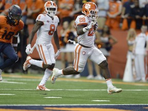 Clemson running back Tavien Feaster (28) crosses the goal line for a touchdown during the first half of an NCAA college football game against Syracuse, Friday, Oct. 13, 2017, in Syracuse, N.Y. (AP Photo/Adrian Kraus)